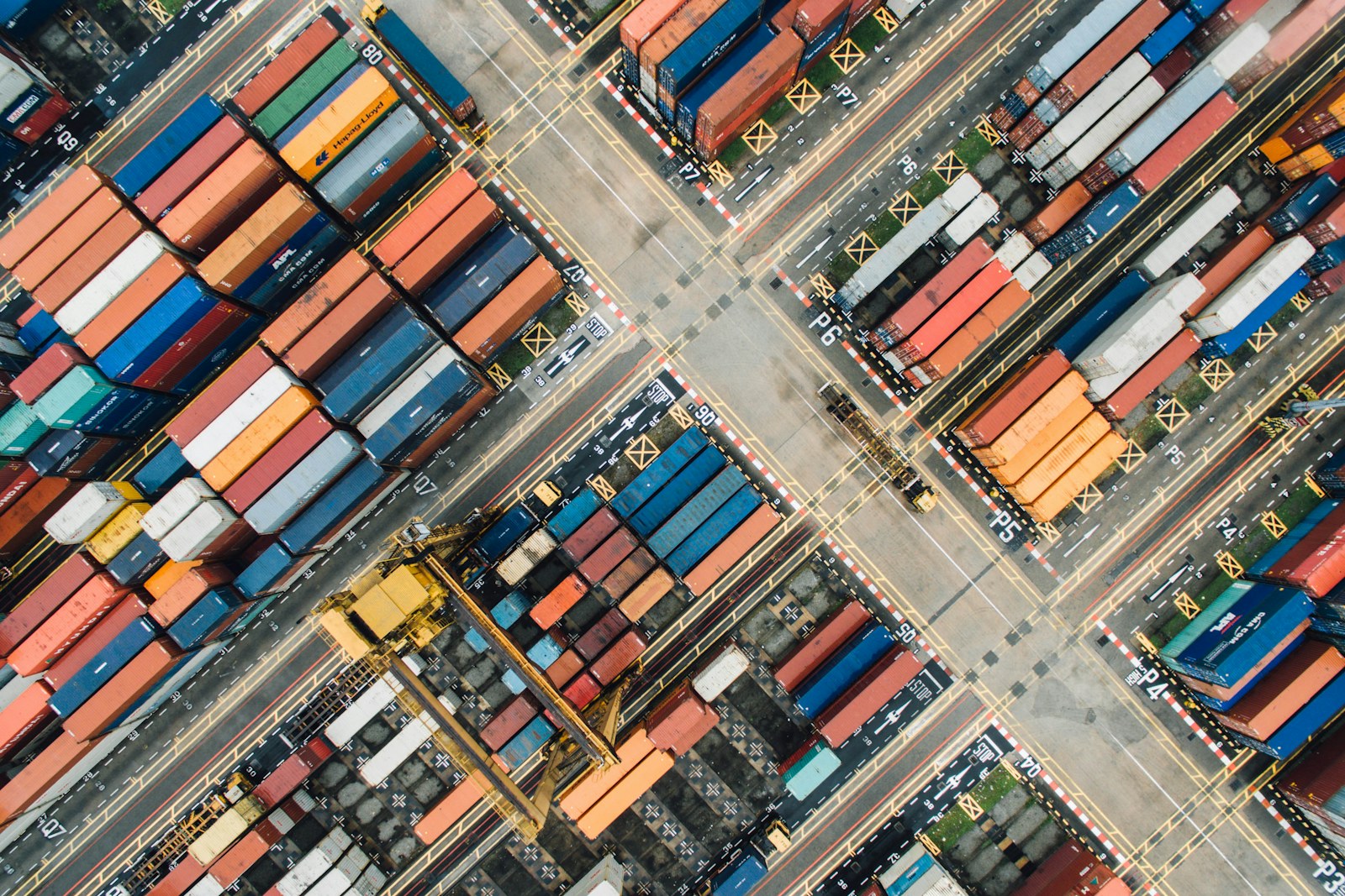 Shipping containers and cranes at a busy international port